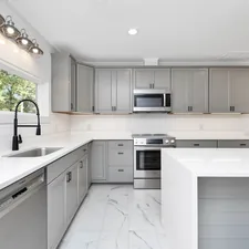 a kitchen with white cabinets related to Elevating Kitchen Style: The Beauty of Valances for Bay Windows
