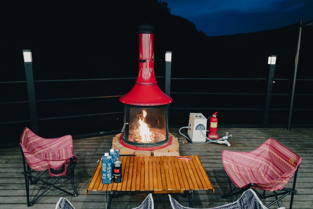 a lamp that is sitting on a table related to Masterpiece Cast Iron Chimineas at Home Depot