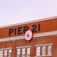 a large brick building with a clock on the front of it related to Transform Your Bedroom with Pier 1 Bedding: A Cozy Sanctuary Awaits