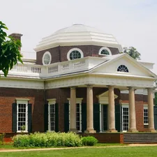 A large brick house with white columns and dome. related to Discover Charming Bed and Breakfasts in Jefferson, TX
