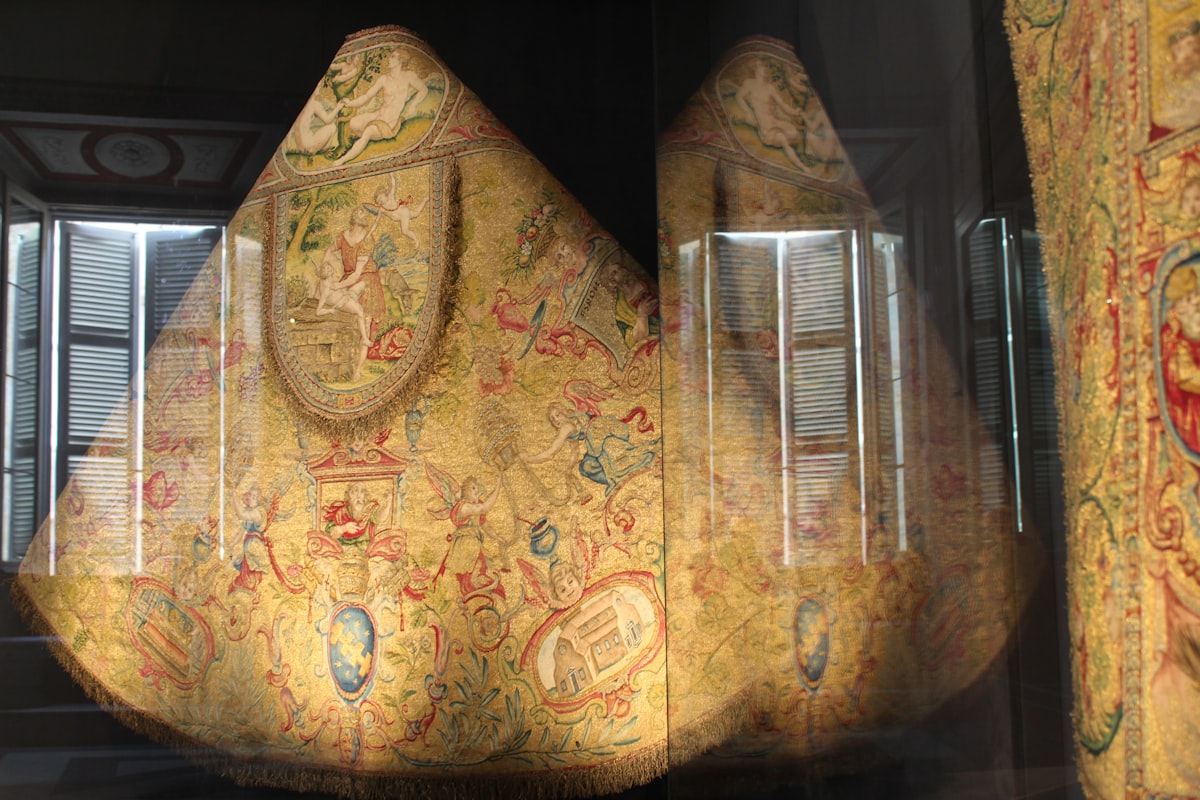a large piece of art that is in a glass case related to Exploring the World of Drapery Valances Styles