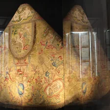 a large piece of art that is in a glass case related to Exploring the World of Drapery Valances Styles