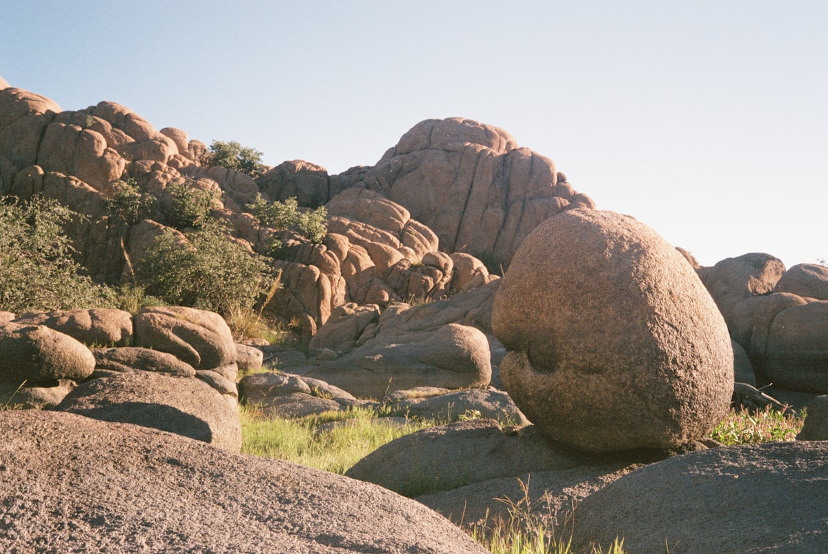 A large rock in the middle of a field related to Bed Bath & Beyond in Boulder: A Shopper's Paradise?