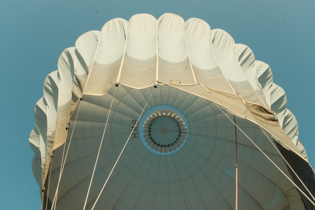 a large white umbrella with a blue sky in the background related to Balloon Shade Valance: Elevate Your Window Style