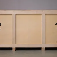 A large wooden crate with shipping symbols. related to The Ultimate Guide to Incorporating a 72 Inch Sideboard in Your Home