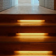 A light shines on a set of stairs related to DIY Wooden Valances: A Step-by-Step Guide
