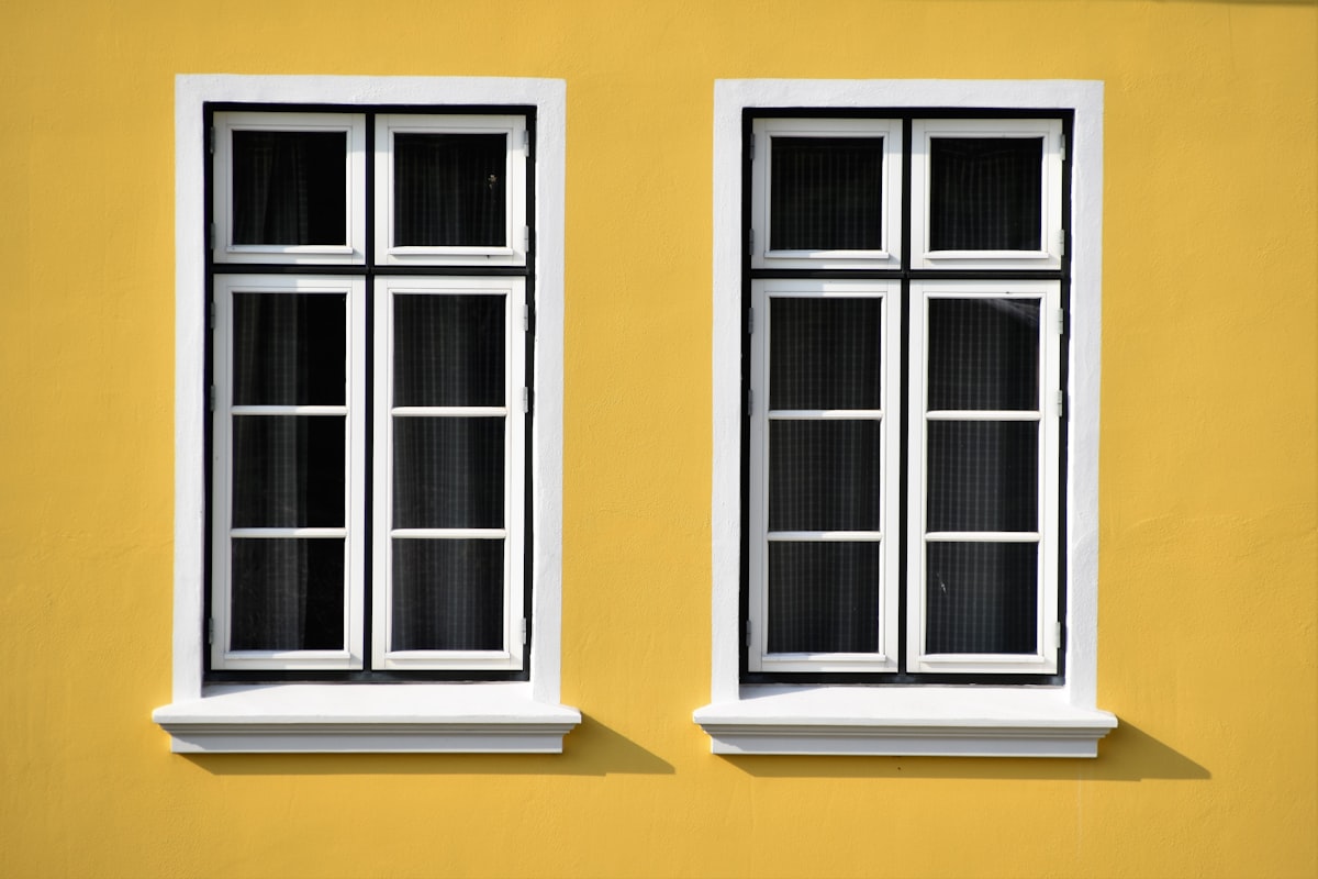 A little yellow house in the fishing town Büsum, North Sea related to Elevate Your Windows with Style: Creative Window Treatments and Valances Ideas