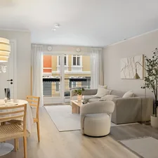 A living room filled with furniture and a dining room table related to The Ultimate Space Saver: Friheten Sofa Bed