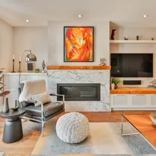 a living room filled with furniture and a fire place related to Enhancing Your Home Decor: The Timeless Appeal of Traditional Curtains and Valances