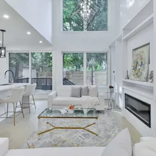 a living room filled with furniture and a fire place related to Transform Your Space with Stunning Blue Toile Valances