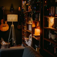 a living room filled with furniture and a guitar related to Elmo's Cozy Corner: Choosing the Perfect Toddler Bed