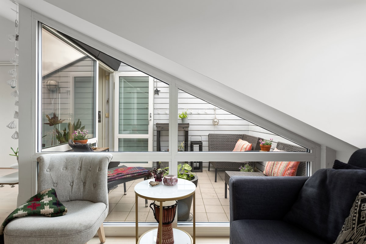 A living room filled with furniture and a large window related to Maximizing Space and Comfort with Lowe's Bed Risers