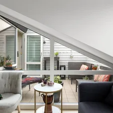 A living room filled with furniture and a large window related to Maximizing Space and Comfort with Lowe's Bed Risers