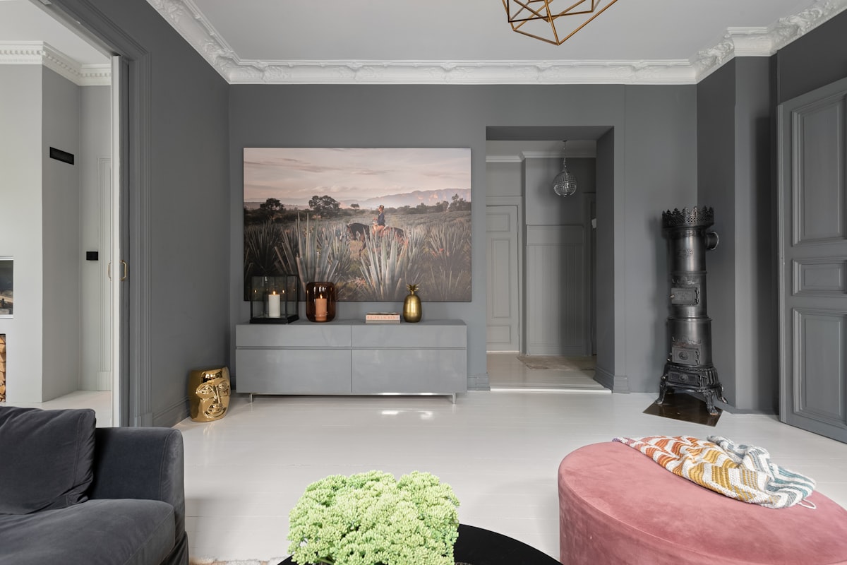 A living room filled with furniture and a painting on the wall related to Grey Painted Sideboard: A Stylish Addition to Your Home