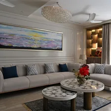a living room filled with furniture and a painting on the wall related to Living Room Valances