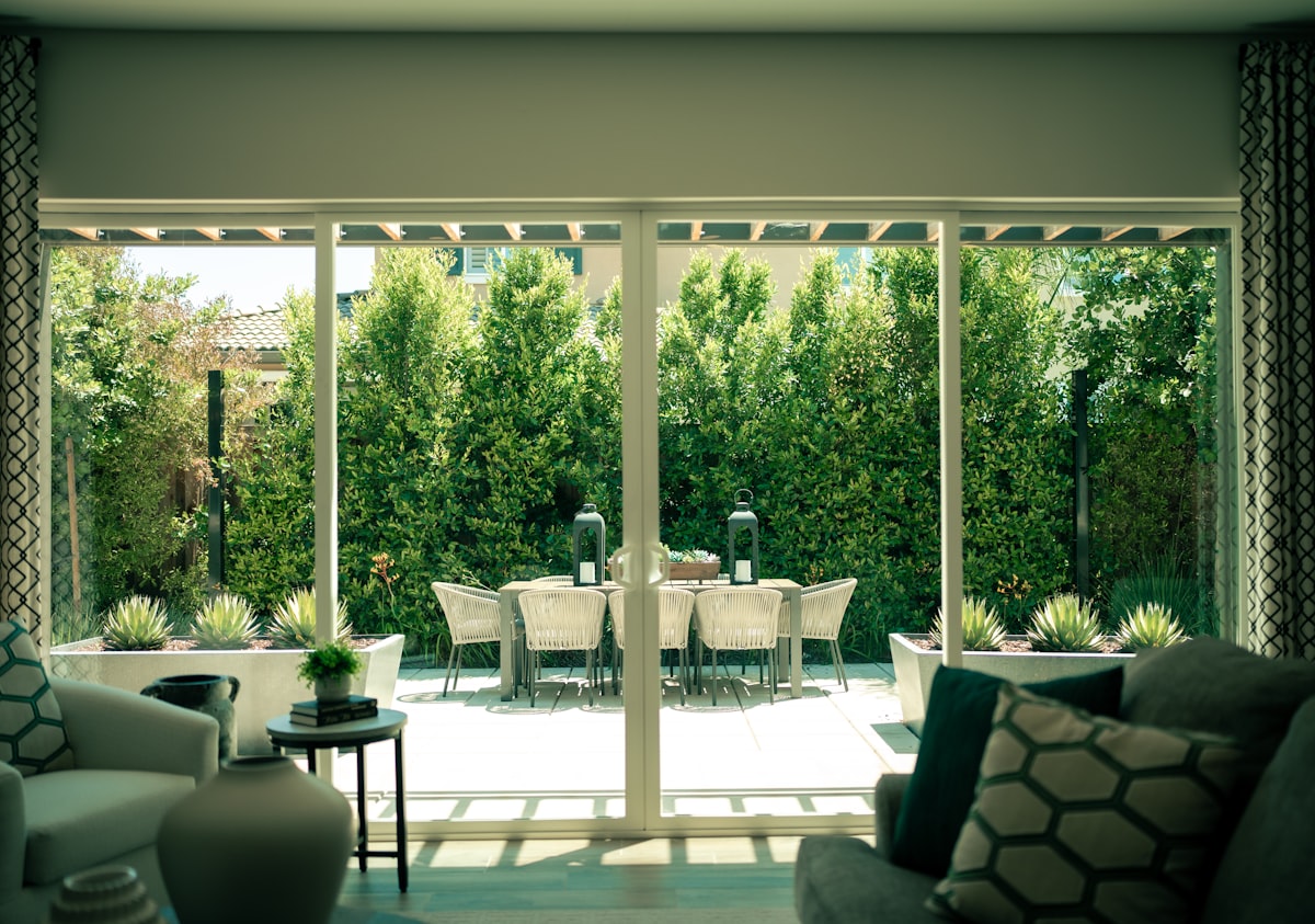 a living room filled with furniture and a sliding glass door related to Patio Door Valance: Elevate Your Outdoor Space with Style
