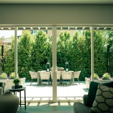 a living room filled with furniture and a sliding glass door related to Patio Door Valance: Elevate Your Outdoor Space with Style