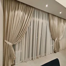 a living room filled with furniture and curtains related to JCPenney Drapes and Valances