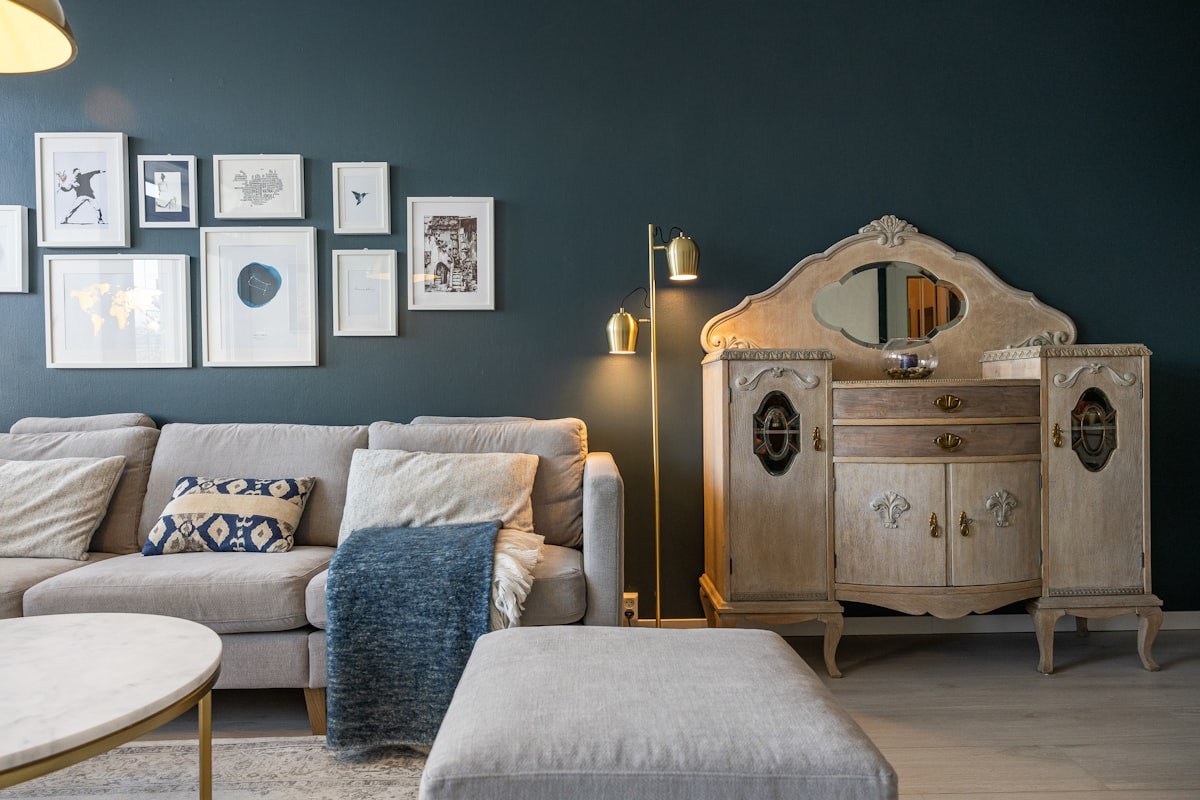 A living room filled with furniture and pictures on the wall related to Small Mirrored Sideboards for Compact Spaces