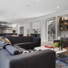 a living room with a couch and a coffee table related to Revolutionizing Your Home with Contemporary Window Valance Ideas