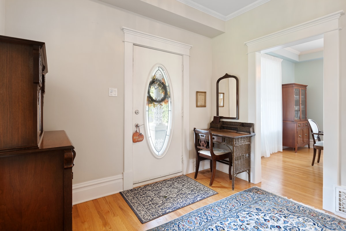 a living room with a piano and a mirror related to Elevate Your Home's First Impression with a Rustic Entryway Table