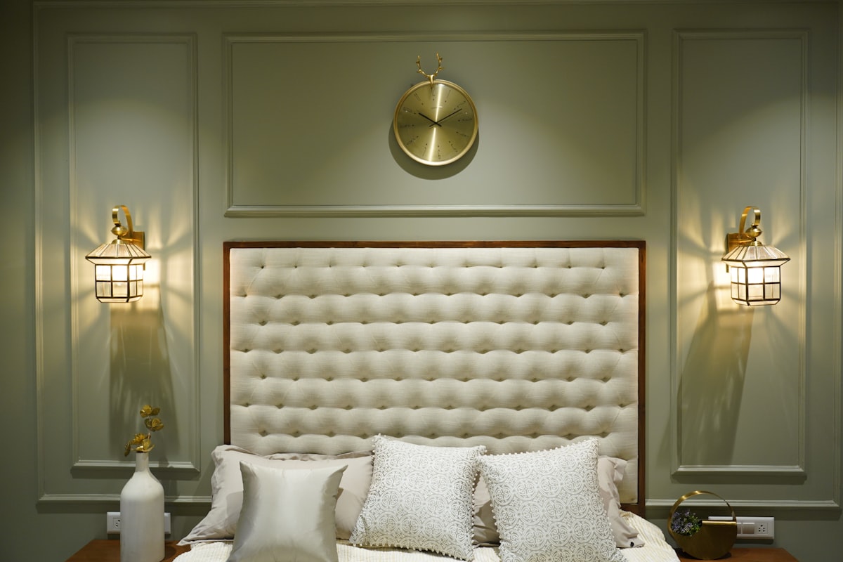A luxurious bedroom with elegant lighting. related to Snuggle in Heavenly Luxury with a White Tufted Bed
