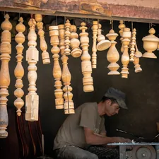 A man working on a piece of wood related to How to Make a Wooden Valance
