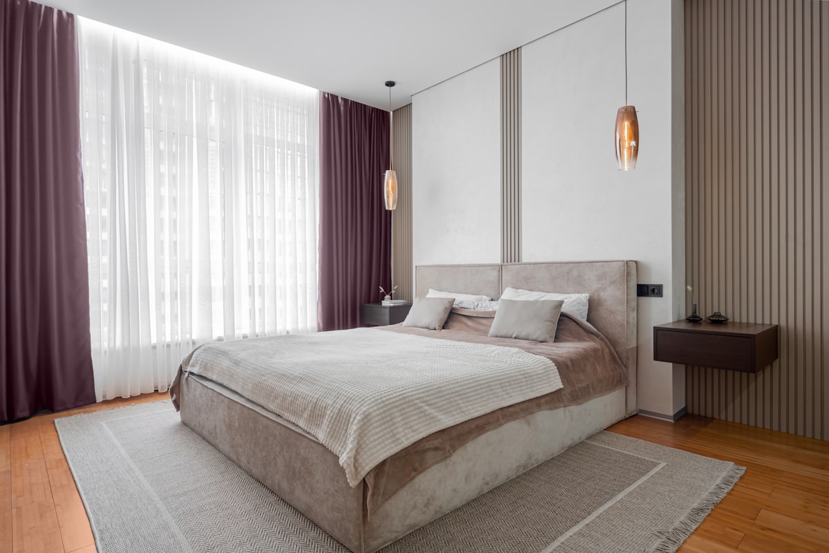 A modern bedroom with a comfy bed. related to Purple and Grey Bedding: Tranquil Tastes for Every Bedroom