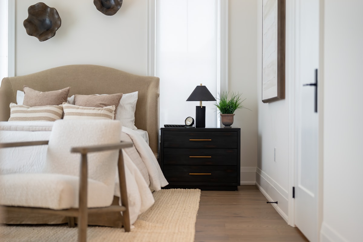 A modern bedroom with a tufted headboard and nightstand. related to The Ultimate Guide to Choosing the Perfect West Elm Bed