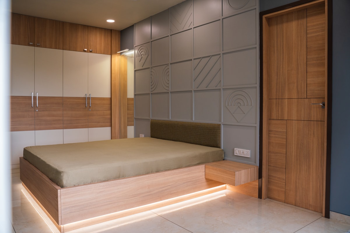 A modern bedroom with unique wall paneling. related to Elevate Your Sleeping Space: The Ultimate Platform Bed with Storage Guide