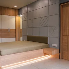 A modern bedroom with unique wall paneling. related to Elevate Your Sleeping Space: The Ultimate Platform Bed with Storage Guide