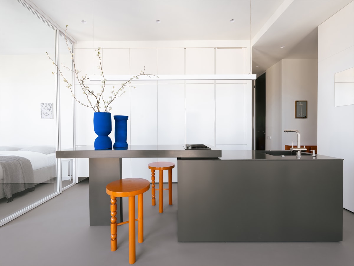 A modern kitchen features a minimalist design. related to Brighten Up Your Space with a Grey and Yellow Valance