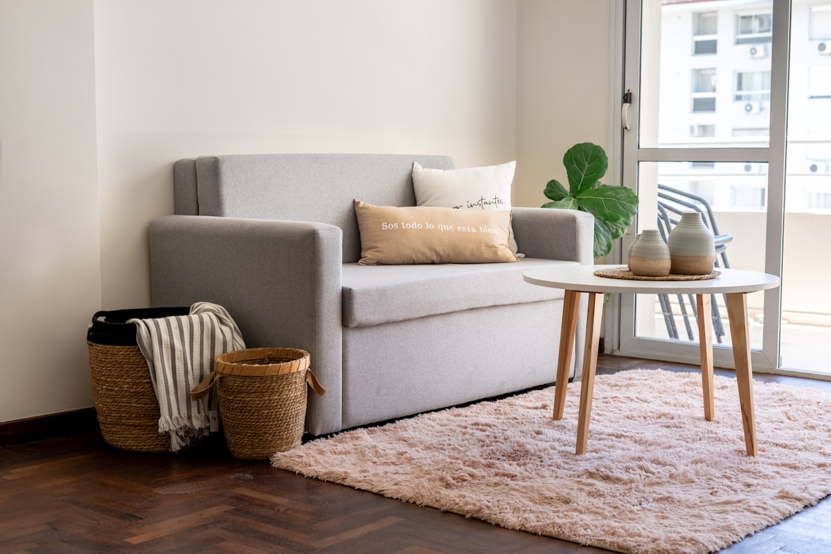 A modern living room with a sofa and coffee table. related to Selecting the Perfect Sofa Bed Mattress: A Comprehensive Guide