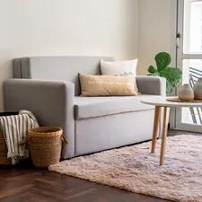 A modern living room with a sofa and coffee table. related to Selecting the Perfect Sofa Bed Mattress: A Comprehensive Guide