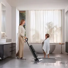 A mother uses a Dreame wet dry vacuum to clean bathroom tiles after her son’s bath, showcasing fast cleanup for everyday messes. related to Elevate Your Home with Black and White Curtain Valance