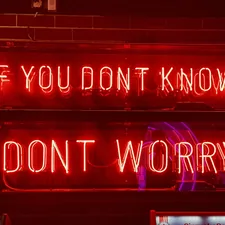 a neon sign that says if you don't know, don't worry related to how to know if you have bed bugs