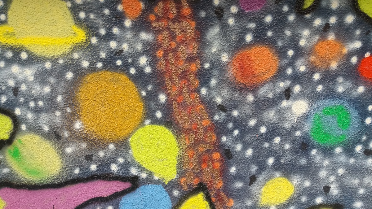 a painting of a tree on a wall related to Cosmic Dreams: The Joy of Galaxy Bed Covers