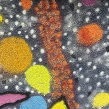 a painting of a tree on a wall related to Cosmic Dreams: The Joy of Galaxy Bed Covers