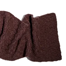 A pair of brown cloths on a white background related to The Timeless Elegance of the Brown Matelasse Coverlet