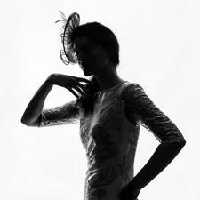 a person in a dress related to A Touch of Timeless Elegance: Styling White Lace Valances