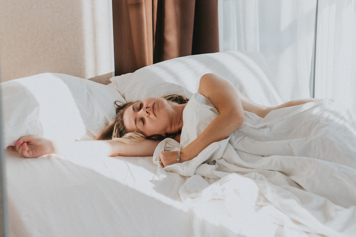 a person lying in a bed related to Infested Nights: Understanding the Risks of Bed Bugs