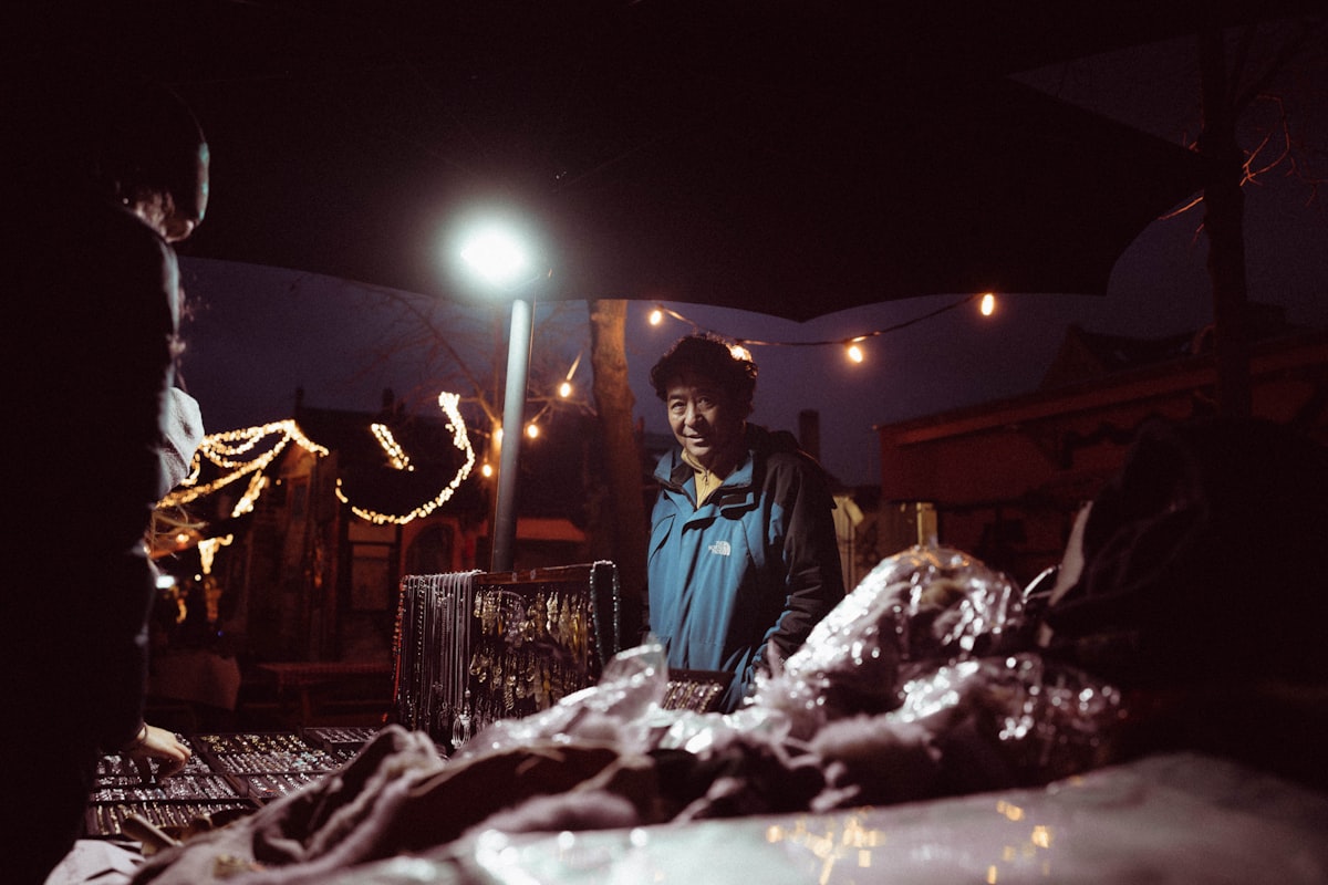 A person standing under a light at night related to Transform Your Bedroom with a Walking Dead Bed Set