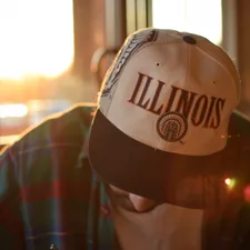 a person wearing a hat with illinois on it related to Charming Bed and Breakfasts in Illinois