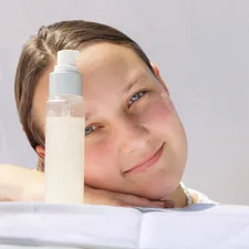 a person with a bottle of water on the head related to Protect Your Skin from Bed Bugs with Effective Repellents