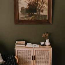 a picture of a room with a chair and a cabinet related to Elevate Your Space with Olive Green Valances: A Comprehensive Guide
