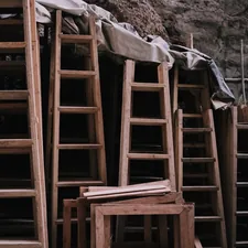 a pile of wooden ladders sitting next to each other related to The Ultimate Guide to Bunk Bed Ladders