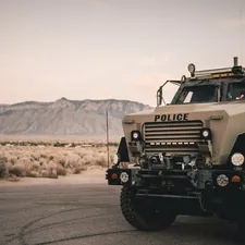 a police truck parked on the side of the road related to Rugged and Reliable: The Military Truck Bed Defined