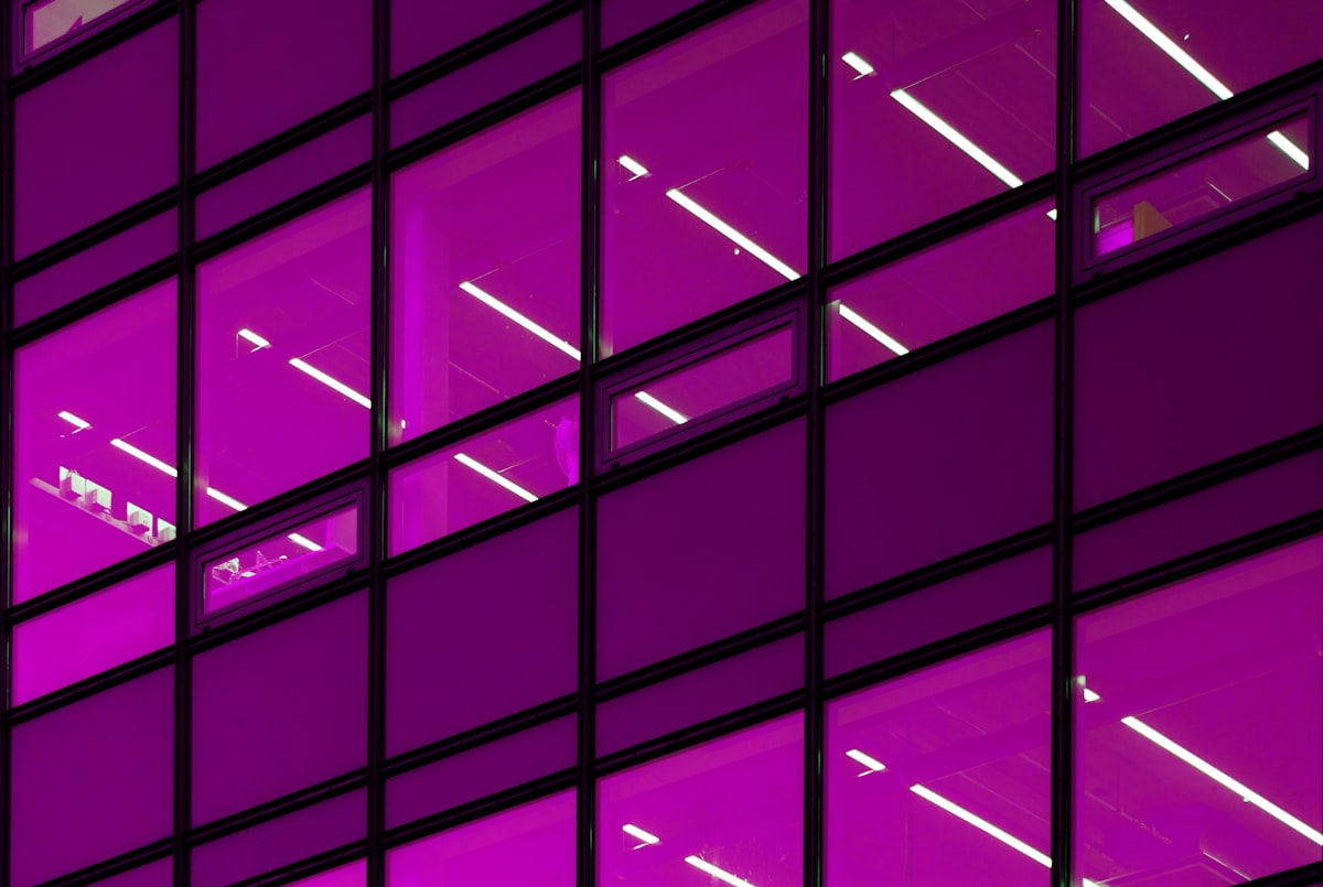 a purple building with lots of windows lit up related to Elevate with Style: Purple Window Valance