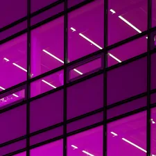 a purple building with lots of windows lit up related to Elevate with Style: Purple Window Valance
