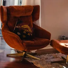 A reading chair in natural light. related to Luxurious Comfort and Style for Your Bedroom